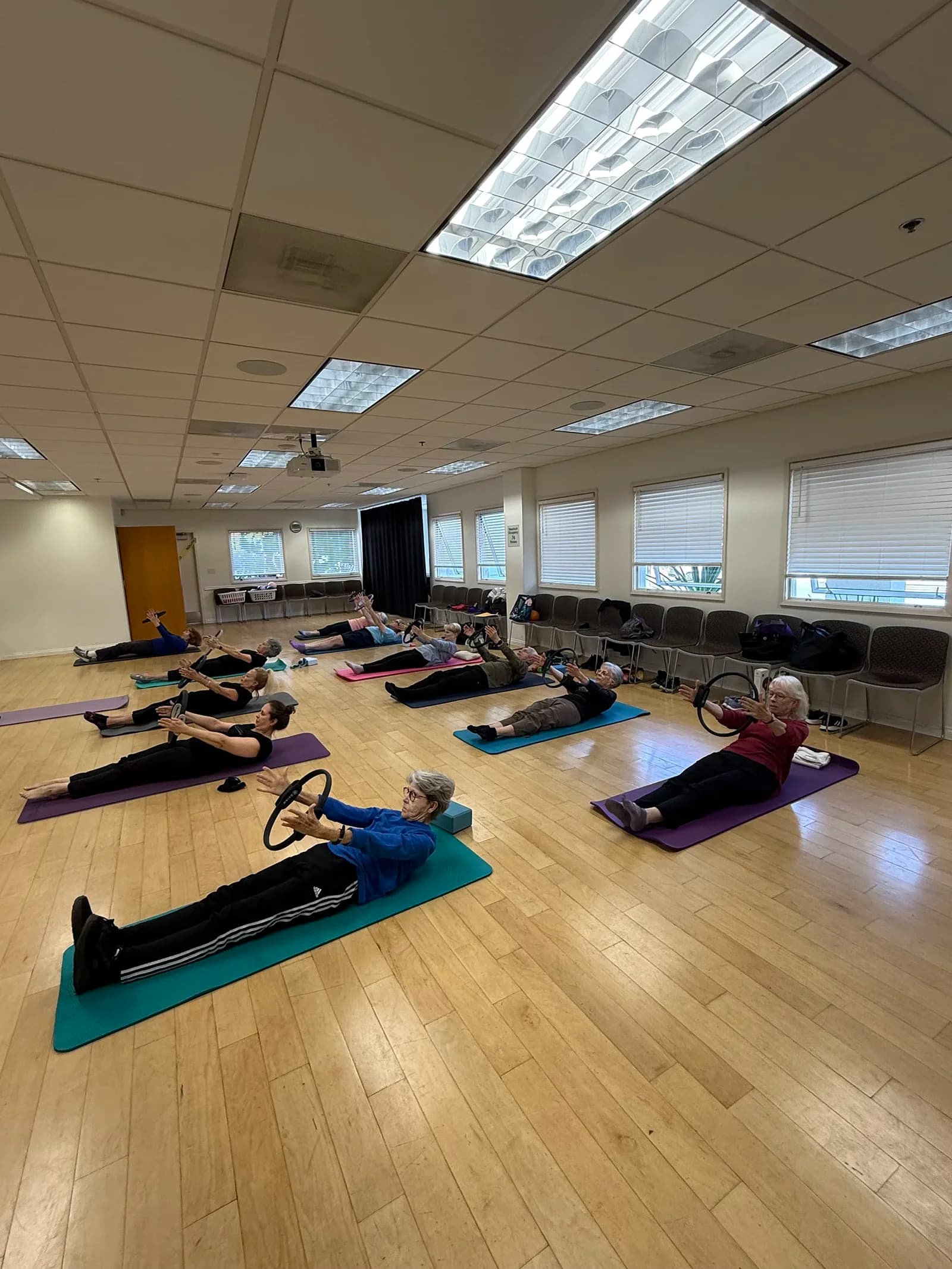 Tracey leading a group of older adults in a 55+ fitness session