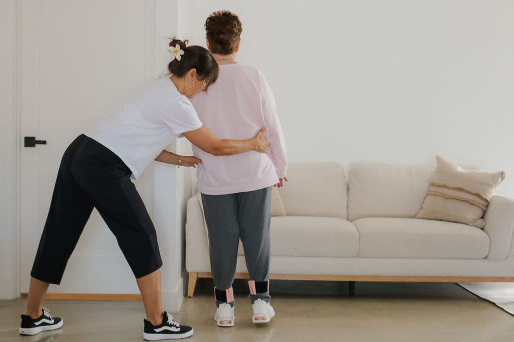 Hands-on therapeutic exercise with a client